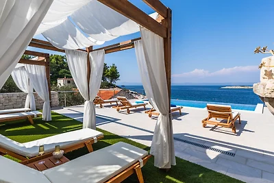 Seafront Villa Mijo by Villas Guide