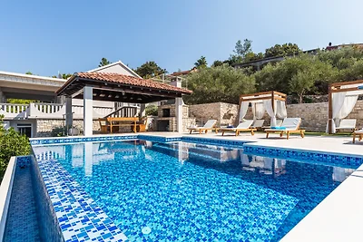Seafront Villa Mijo by Villas Guide