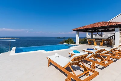 Seafront Villa Mijo by Villas Guide