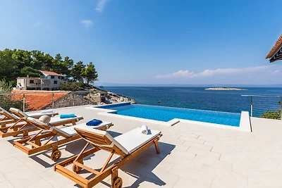 Seafront Villa Mijo by Villas Guide
