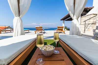 Seafront Villa Mijo by Villas Guide