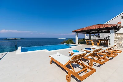 Seafront Villa Mijo by Villas Guide