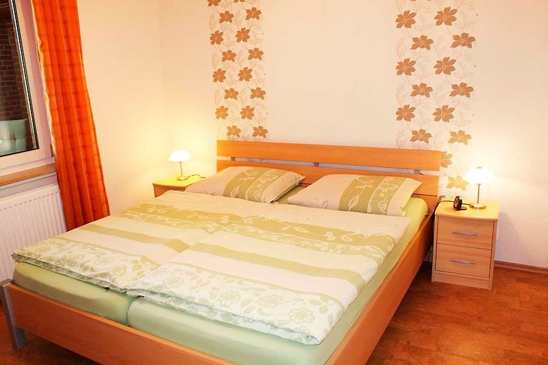 Bright bedroom with double bed