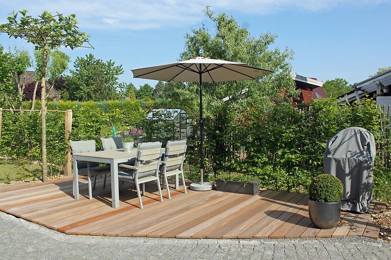 Terrace with garden furniture and barbecue