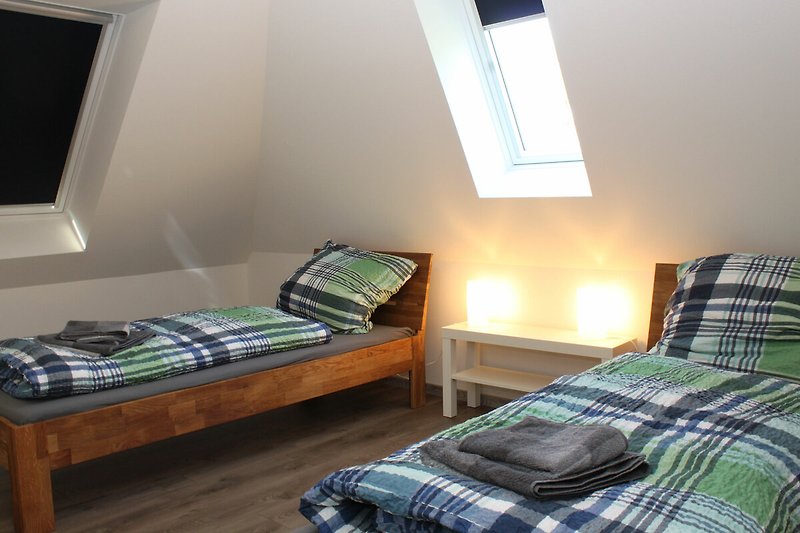 Bedroom with two single beds in the attic