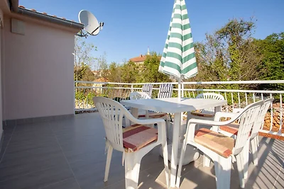 Appartamento in casa con terrazza coperta