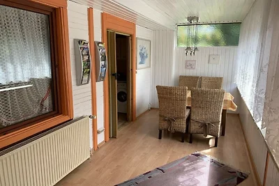 Houten vakantiehuis met wintertuin