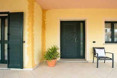 Ferienhaus in Telti mit Terrasse