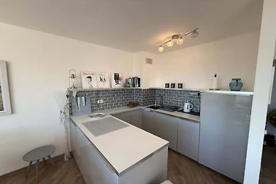 Appartement aan het strand met balkon