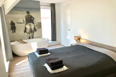 Lodge mit Blick auf die Kirche und die Dünen