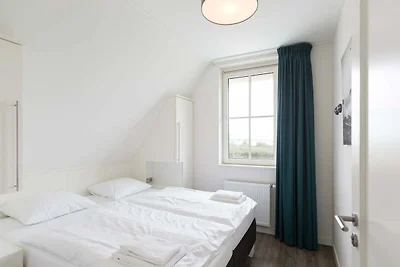 Villa mit Strohdach mit einer Sauna in...