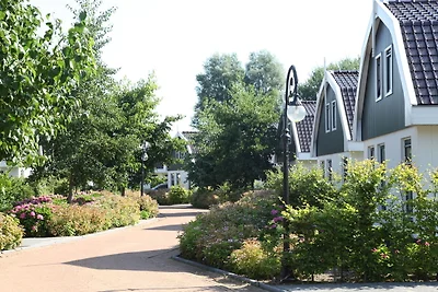 Strahlendes Haus am Strand mit Garten in...