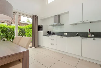 Bungalow moderno con lavatrice nel verde