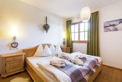 Ferienhaus mit verschneitem Blick