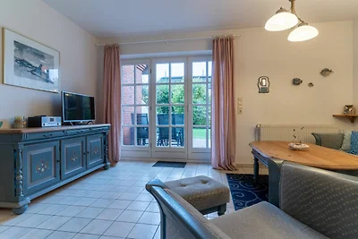 Apartment mit Kamin in einer reetgedeckten...