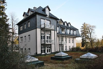 Appartement in spar met een balkon of een...