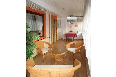 Houten vakantiehuis met wintertuin