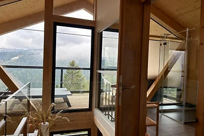 Chalet mit Sauna auf dem Balkon