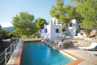 Holiday in Ibiza, nestled between green with ...