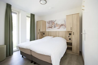 Bungalow mit einer überdachten Terrasse
