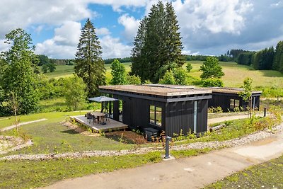 Schöne Lodge mit Sauna in einem Naturresort