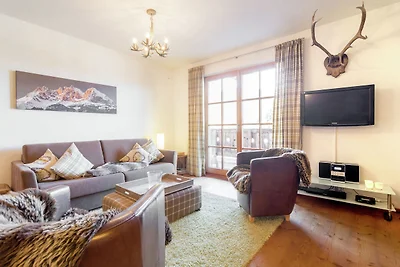Ferienhaus mit verschneitem Blick