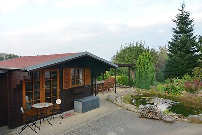 Appartement met blokhut, vijver en overdekte ...