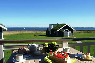 Bungalow moderno con stufa a legna e vista...