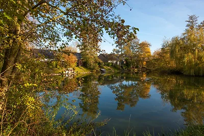 Schöne Villa mit Veranda in einem Ferienpark ...