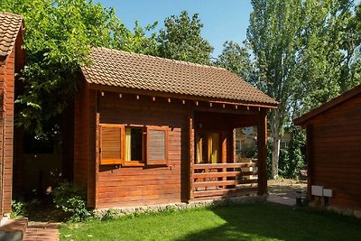 Wooden bungalow with a covered terrace, 1 km.