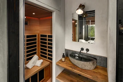 Bel lodge con sauna in un resort naturale