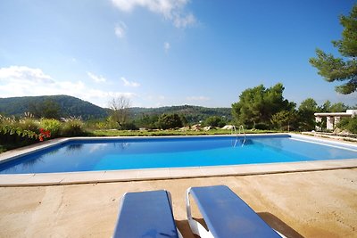 Holiday in true Ibiza style between hills wit...
