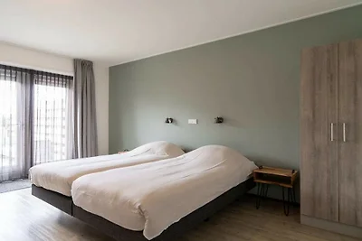 Wohnung in Hollum mit Schwimmbecken