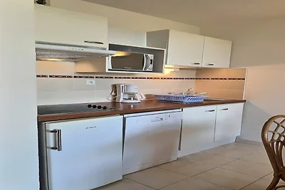 Appartement aan het strand met zwembad