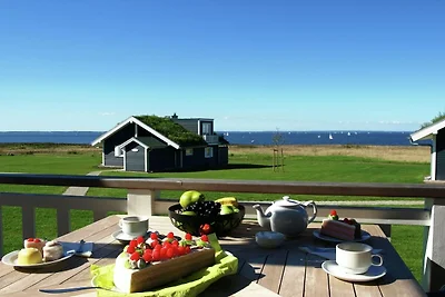 Bungalow moderno con stufa a legna e vista...