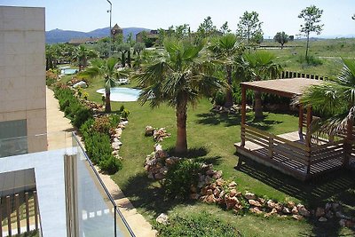 Wohnung in La Escala mit einem Lounge-Set