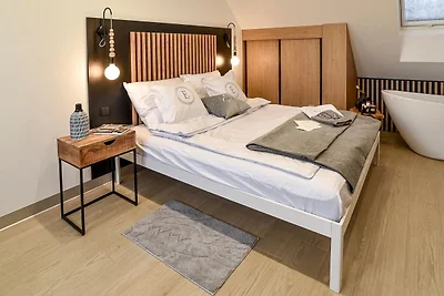 Ferienhaus, Schlafzimmer mit Badewanne,...