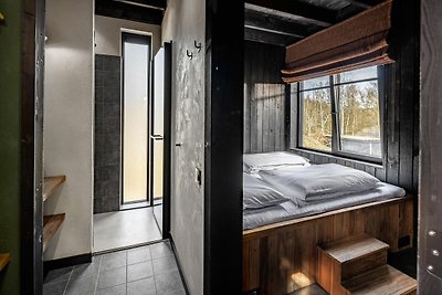 Schöne Lodge mit Sauna in einem Naturresort