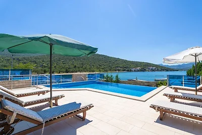 Beachfront Apartment house Hon with pool