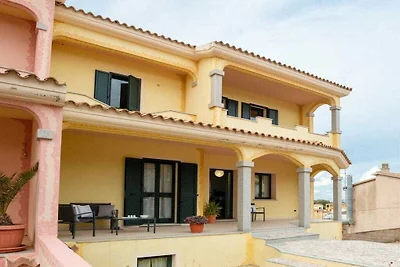 Ferienhaus in Telti mit Terrasse