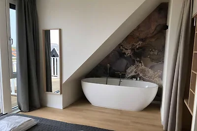 Lodge im 2. Stock mit Blick auf die Dünen.