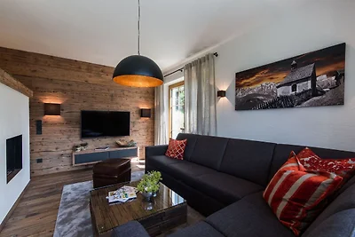 Luxe chalet met vier badkamers, bij een...