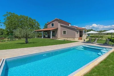 Holiday home in Tinjan with swimming pool
