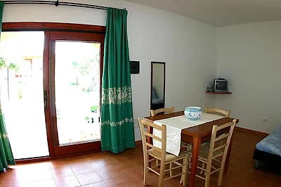 Appartement in Badesi met gedeeld zwembad