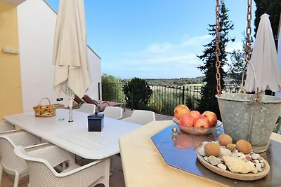 Huis in Muro met uitzicht op de baai van...