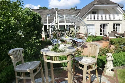 A in het huis in de rozentuin