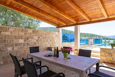 Beachfront Apartment house Hon with pool