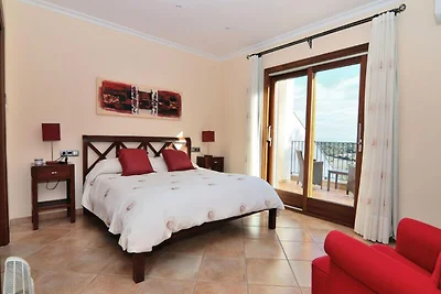 Huis in Muro met uitzicht op de baai van...