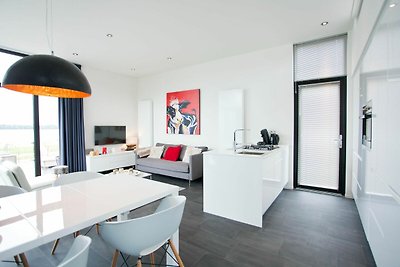 Modernes Ferienhaus mit Geschirrspüler in ein...