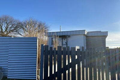 Ons strandhuis, tuin en zee